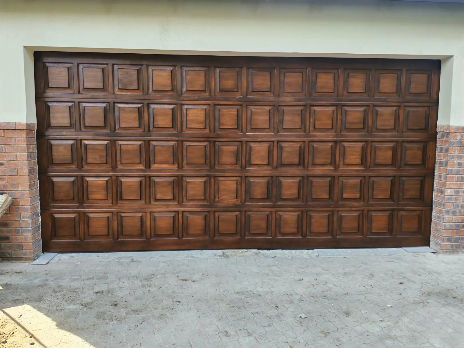 Wide view of a finished timber-look garage door